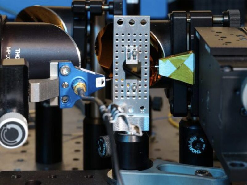 Hybrid photonic-terahertz chip for communications and sensing