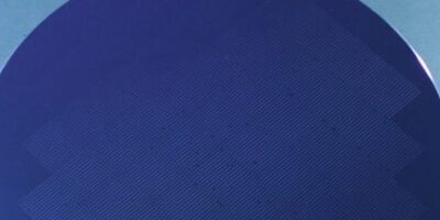 Tiling process mounts InP optical devices on 300mm substrate