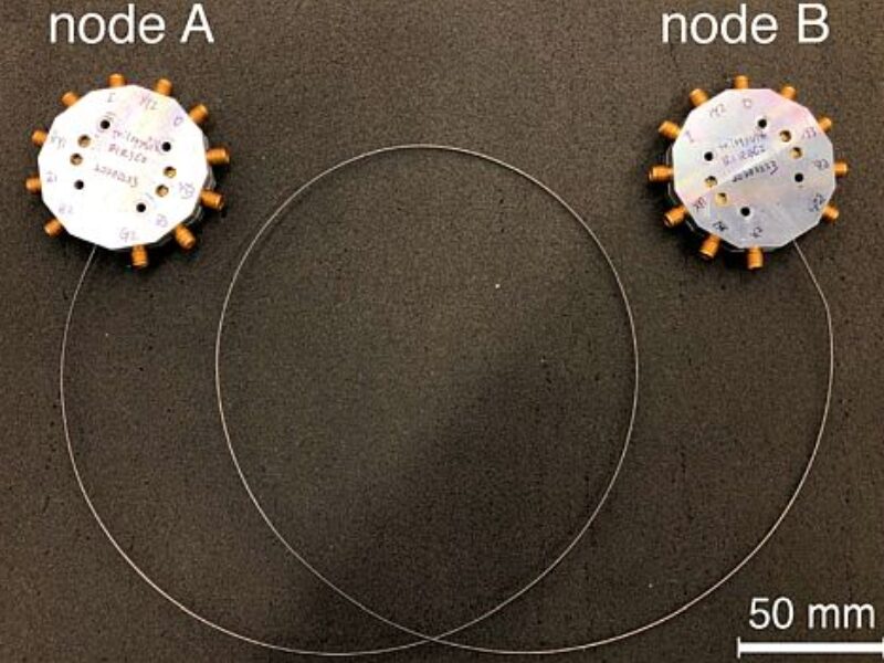 Entangled qubit states sent through a communication cable