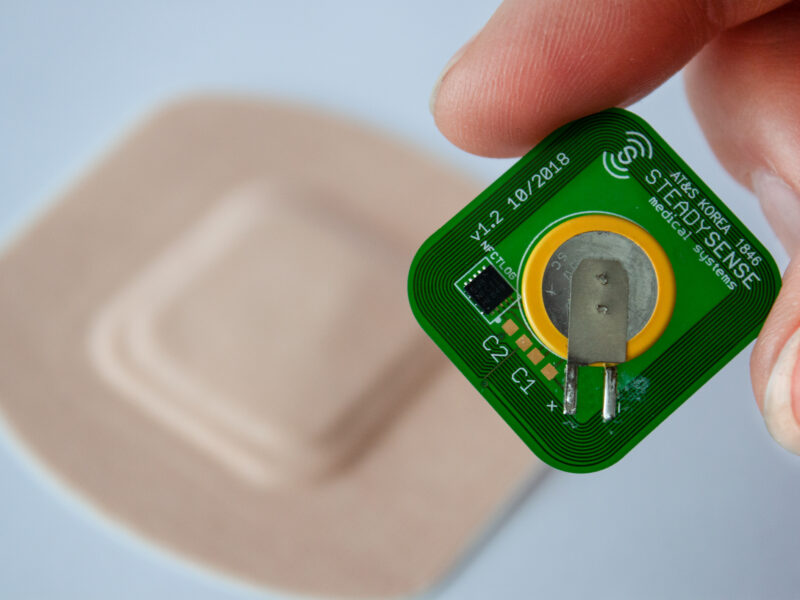 Adhesive patch monitors body temperature